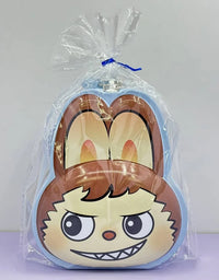 Plush toy with cartoon face design in clear packaging on a white background
