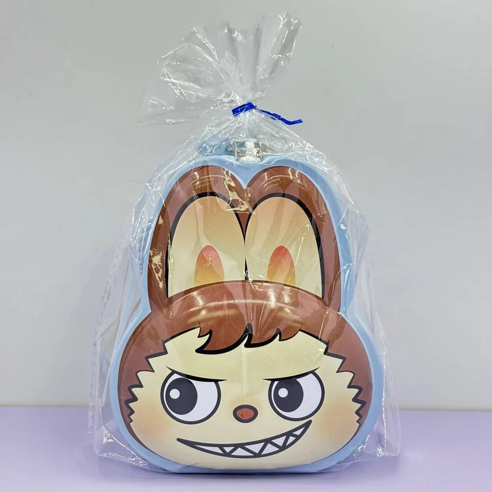 Plush toy with cartoon face design in clear packaging on a white background