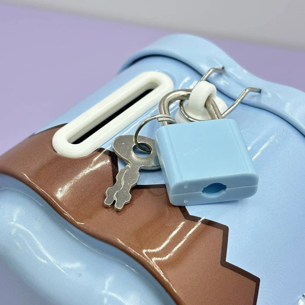 Close-up of a blue lock and keys on a pastel-colored object